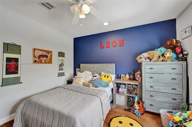 bedroom featuring hardwood / wood-style floors and ceiling fan