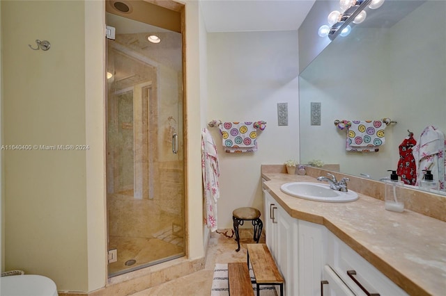 full bath with a shower stall and vanity