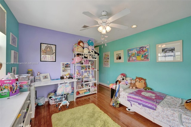 bedroom featuring ceiling fan, wood finished floors, and recessed lighting