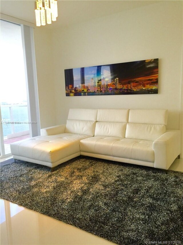 living room with an inviting chandelier