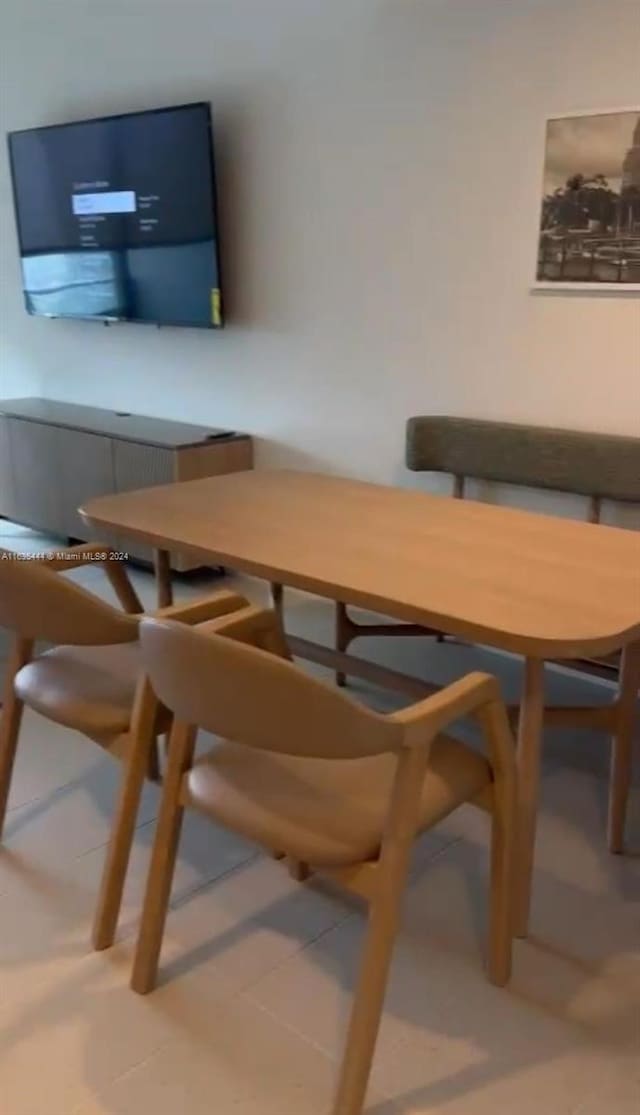 dining area with tile patterned floors