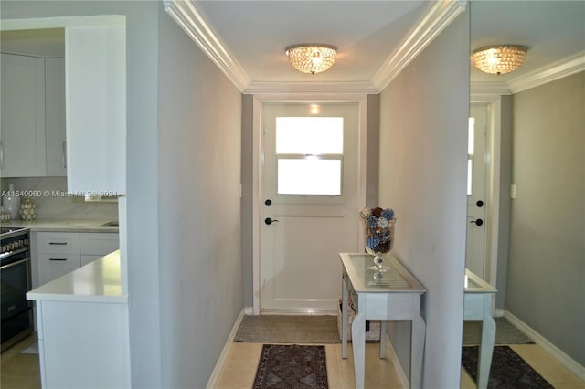 doorway to outside with light tile patterned floors and crown molding