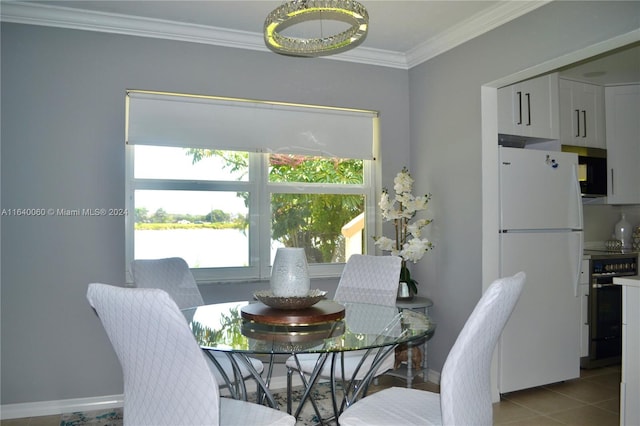 dining room with light tile patterned flooring and ornamental molding