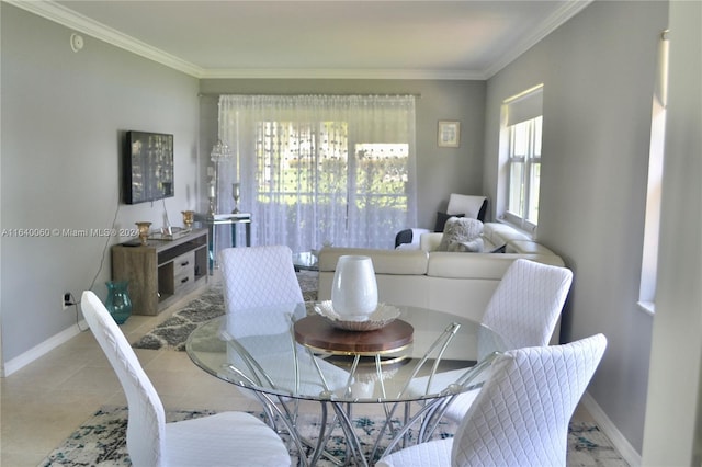 tiled dining space featuring ornamental molding