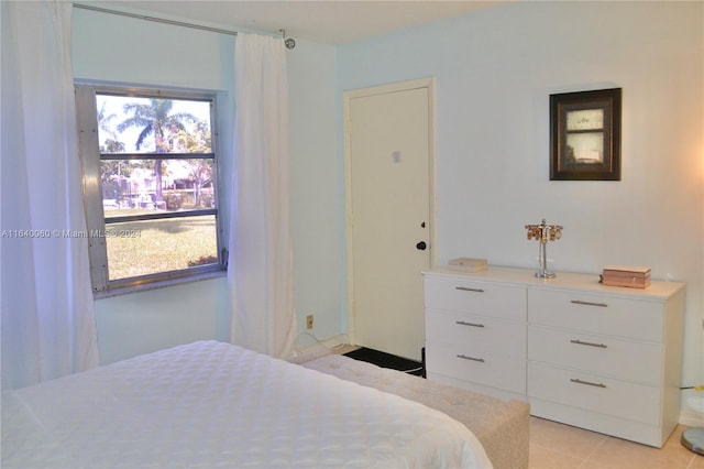 bedroom featuring light tile patterned flooring