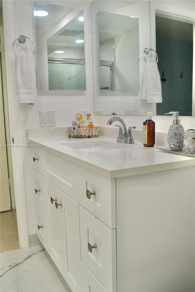 bathroom with vanity and tile patterned flooring