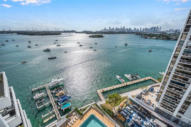 birds eye view of property featuring a water view