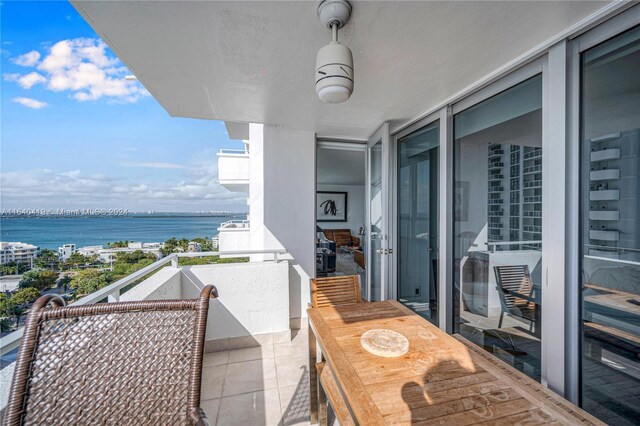 balcony featuring a water view