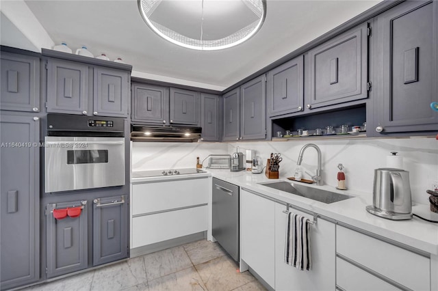 kitchen with decorative backsplash, stainless steel oven, light tile patterned floors, black electric cooktop, and sink