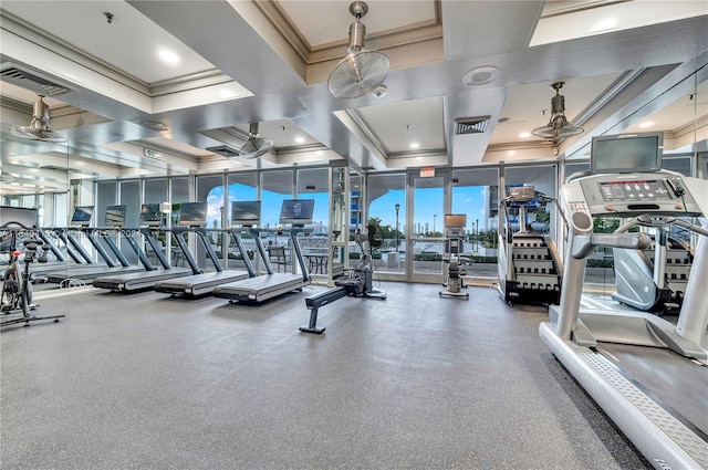 exercise room featuring ceiling fan, ornamental molding, and coffered ceiling