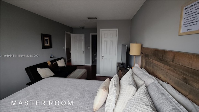 bedroom featuring wood-type flooring