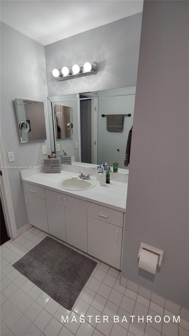 bathroom featuring vanity and tile patterned flooring