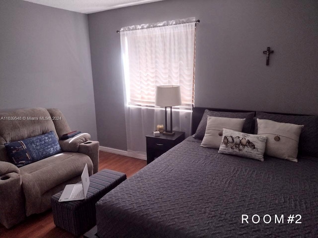 bedroom with wood-type flooring