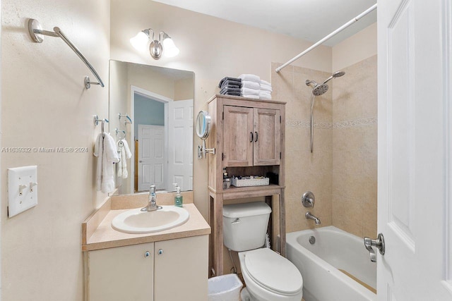 full bathroom with vanity, toilet, and tiled shower / bath combo