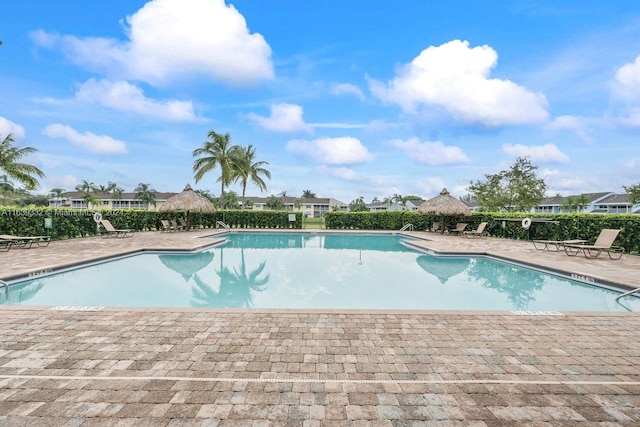 view of swimming pool featuring a patio area