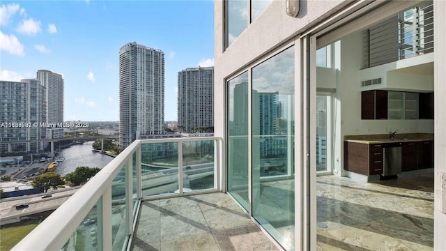 balcony featuring a water view