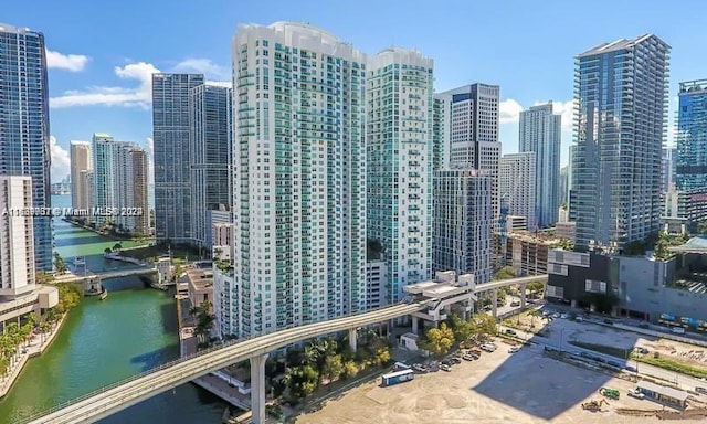 property's view of city featuring a water view