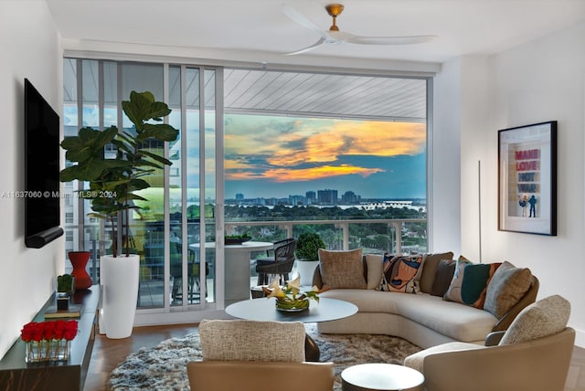 living room with hardwood / wood-style floors and ceiling fan