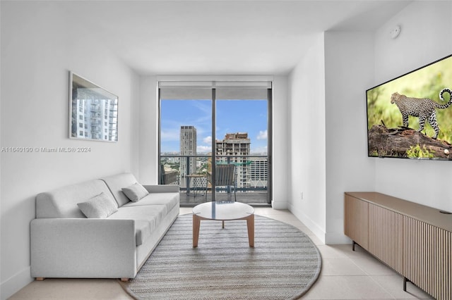 living room featuring floor to ceiling windows