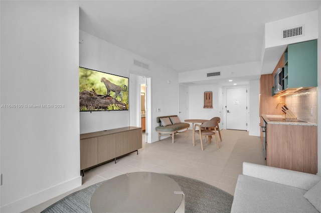 dining area featuring light tile patterned flooring