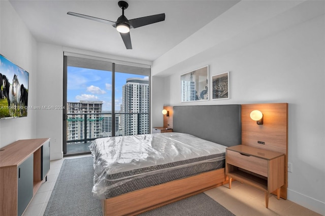 bedroom featuring ceiling fan, access to exterior, light tile patterned flooring, and multiple windows