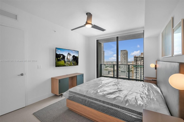 bedroom featuring ceiling fan and access to exterior