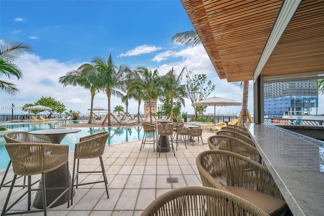 view of patio with a community pool