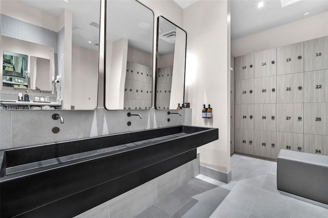 bathroom featuring vanity, tile walls, and tile patterned flooring