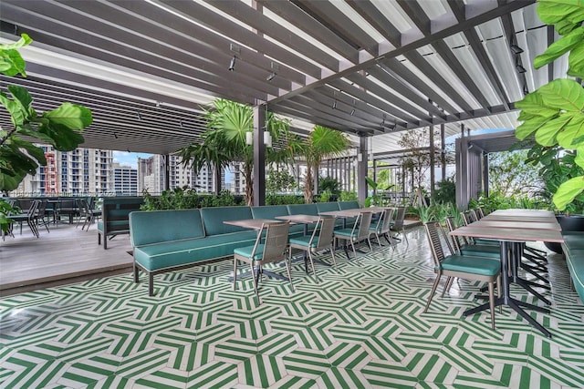 view of patio with a pergola and a wooden deck