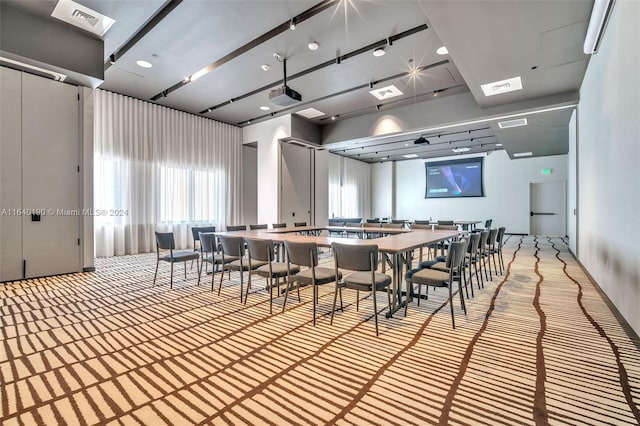 unfurnished dining area featuring light carpet