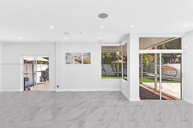 unfurnished room with plenty of natural light