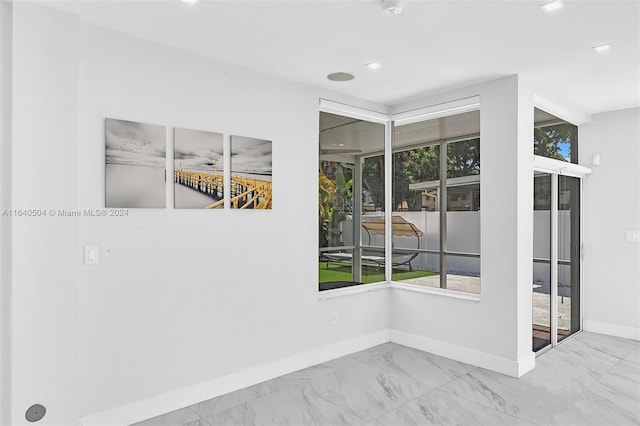 spare room with a wealth of natural light