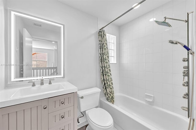 full bathroom featuring vanity, toilet, and shower / bath combo with shower curtain