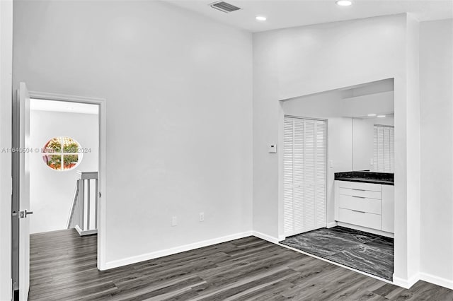 interior space with dark hardwood / wood-style flooring