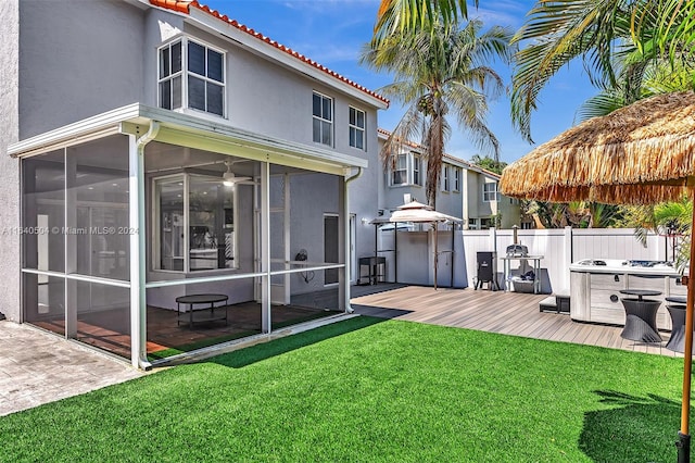 exterior space with a deck and a sunroom