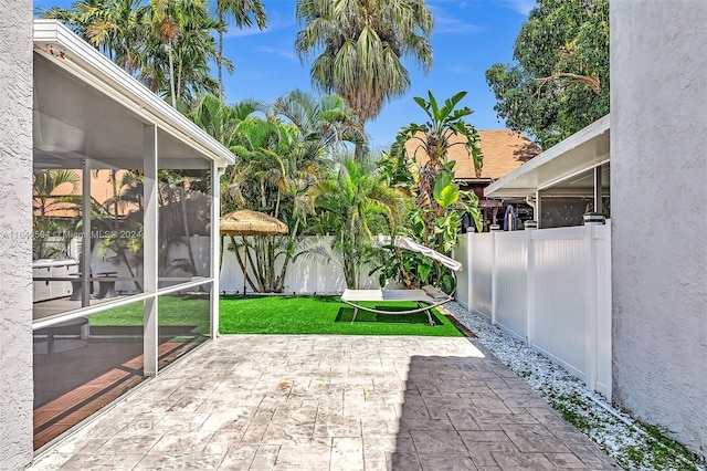 view of patio / terrace with a sunroom