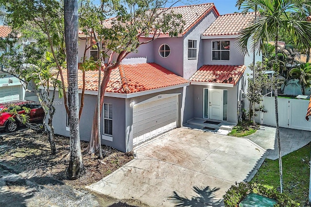 mediterranean / spanish-style home featuring a garage