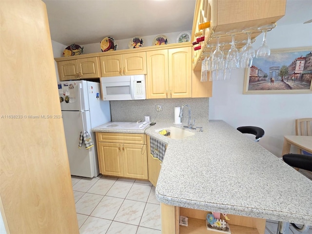 kitchen with light brown cabinets, light tile patterned flooring, backsplash, white appliances, and sink