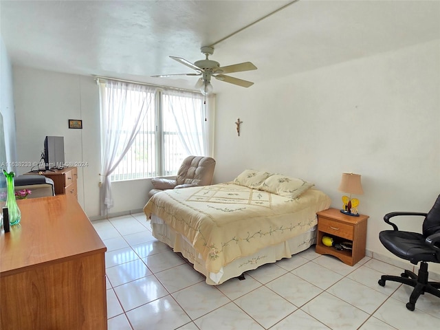 bedroom featuring light tile patterned flooring and ceiling fan