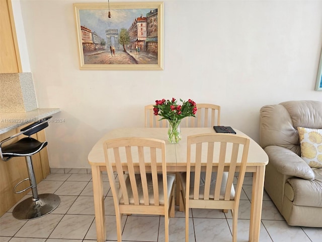 dining room featuring light tile patterned floors