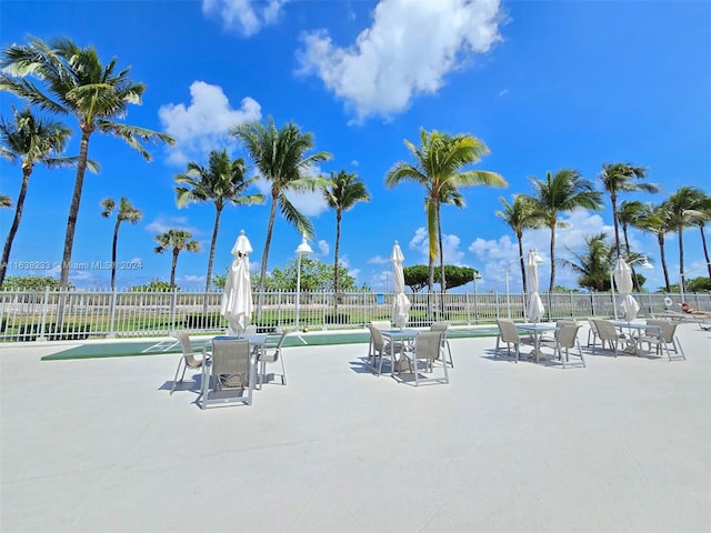 view of home's community featuring a patio area and a pool