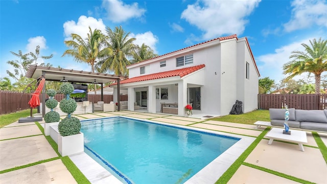 4260 SW 149th Ct, Miami, FL 33185 - rear view of property featuring an outdoor hangout area, a fenced backyard, stucco siding, and a patio area