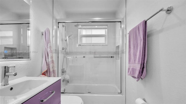 4260 SW 149th Ct, Miami, FL 33185 - full bathroom featuring a textured wall, bath / shower combo with glass door, toilet, and vanity