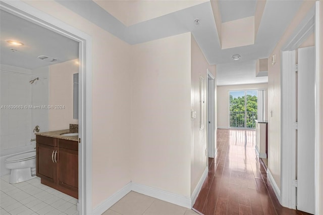 hallway featuring light tile patterned floors