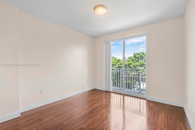 spare room with hardwood / wood-style floors