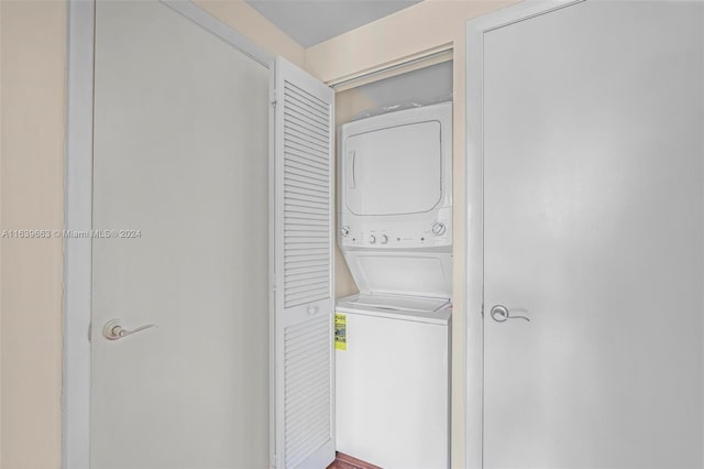 laundry room featuring stacked washer and dryer