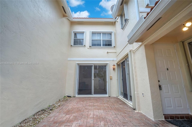 entrance to property with a patio area