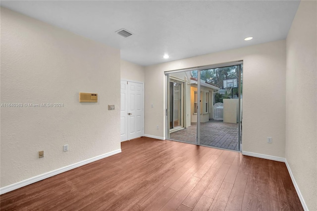 empty room featuring hardwood / wood-style flooring