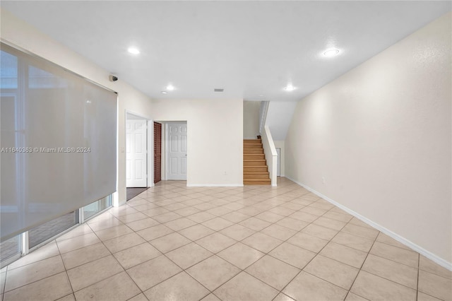 unfurnished room with light tile patterned floors