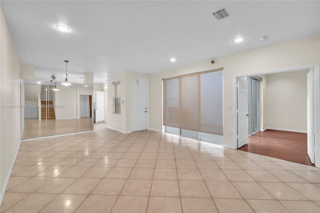 empty room featuring light tile patterned flooring